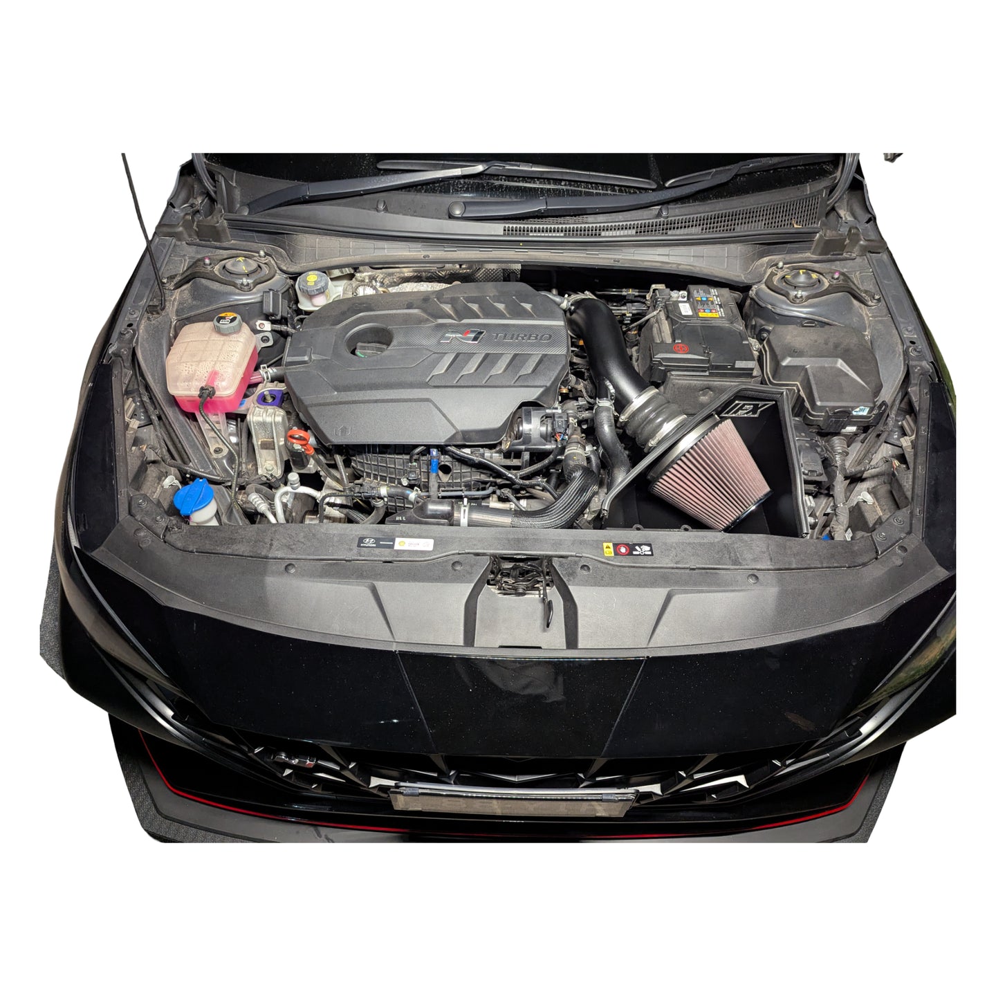 Overhead view of the i30 Sedan N engine bay with the IFX intake fitted, illustrating the top-seal airbox design that prevents heat soak.